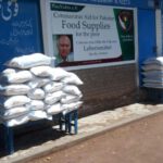 Picture of piled bags of rice ready for distribution in St. Peter's