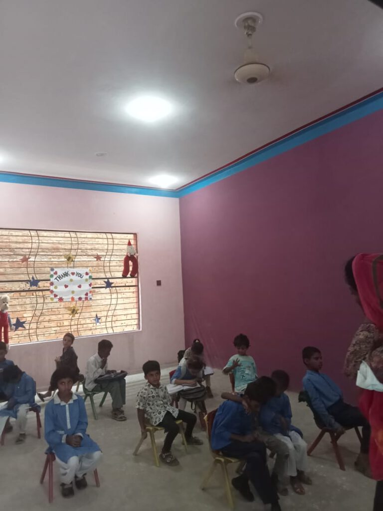 Group of students in the new class room.
